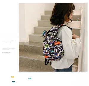 Detail of cartoon toddler backpack with Mickey Mouse print and 3D ears for safety