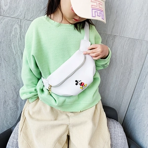 White Mickey Mouse kids chest bag with gold zipper and adjustable strap on child model