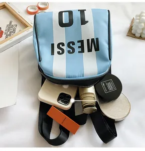 Interior capacity detail of Messi 10 nylon backpack showing phone and makeup items