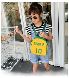 Close-up of yellow and green nylon kids backpack with Neymar Jr 10 football print