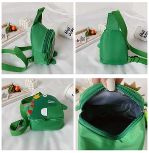 Detail view showing stitching, zipper, and interior of dinosaur crossbody bag
