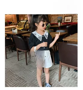 Girl holding a red nylon football backpack with GO CHINA text in a cafe setting