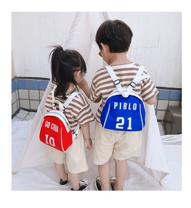 Rear view of children wearing red and blue mini backpacks with adjustable white straps