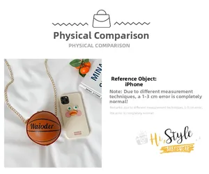 Detailed comparison of basketball-shaped PU leather purse next to an iPhone for size scale