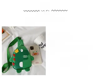 Detail of green dinosaur chest bag for kids with iPhone for size comparison