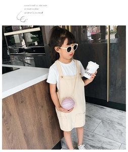 Toddler summer outfit set with white T-shirt, beige suspender skirt, and purple basketball bag