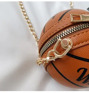 Detail of basketball shaped bag with gold chain strap, zipper and number 23 print
