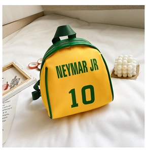 Detail of yellow nylon kids backpack featuring Neymar Jr 10 print and green zippers