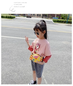 Kids pink long-sleeve tee with Lotso print and yellow candy shaped crossbody bag on girl