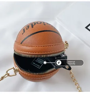 Interior capacity view of orange basketball chain purse holding small cosmetics