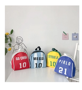 Detailed macro shot of mini football jersey backpacks in red, blue, yellow, and navy