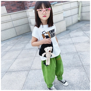 Kids black crescent crossbody bag featuring a cute plush bear and white strap detail