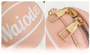 Detail der pinkfarbenen Basketball-Kindertasche mit Litschi-Textur und Gold-Zippern