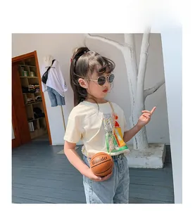 Close-up of children basketball shaped crossbody bag with realistic texture and gold chain