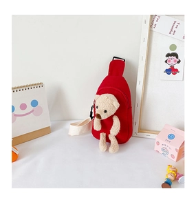 Detail of red canvas kids chest bag with a cute 3D plush bear and adjustable strap