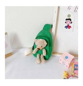 Close-up of green canvas kids chest bag with a cute 3D plush teddy bear and woven strap