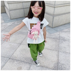 Pink canvas crossbody chest bag for kids featuring a cute plush bunny doll decoration