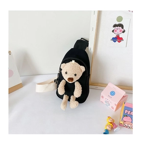 Detail shot of black canvas kids chest bag with a cute plush 3D teddy bear decoration