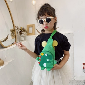 Cute green dinosaur kids chest bag with adjustable strap worn by child model