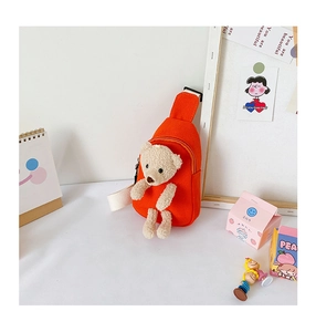Detail of orange canvas kids crossbody bag with 3D teddy bear and adjustable strap