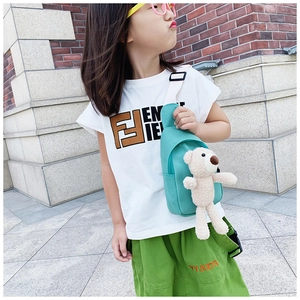 Detail of mint green kids crossbody chest bag with cute beige teddy bear charm