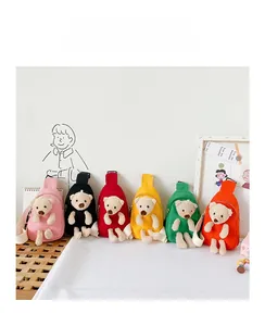 Detailed display of colorful canvas chest bags for kids with 3D plush bear decorations