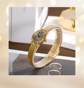 Detail view of gold octagonal watch face with Roman numerals and stainless steel strap
