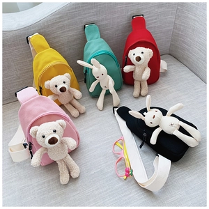 Detailed display of cute canvas cross-body bags with plush bear charms in five vibrant colors