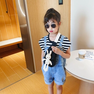Kids black canvas crossbody chest bag with cute white rabbit plush doll decoration