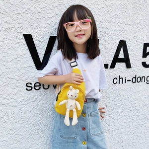 Cute yellow canvas crossbody bag for kids featuring a soft bunny doll with white strap