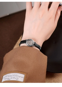 Detail of GEDI small oval ladies watch with silver dial and black leather strap