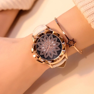 Women's quartz watch with diamond lotus dial and white leather strap set with star bracelet