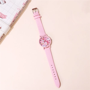 Detail shot of a pink unicorn dial watch for girls with easy-to-read numbers