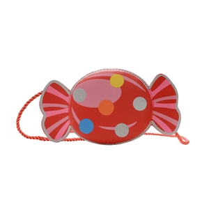 Cute candy-shaped red crossbody bag for kids with colorful polka dots and woven strap