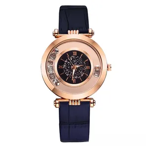Detail of rose gold case with rolling crystals and navy blue faux crocodile strap