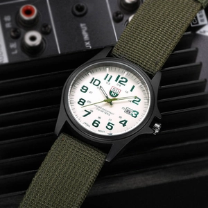 Detail of military quartz watch with nylon strap and 200m water resistant dial
