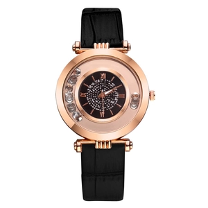 Women's rose gold watch with moving crystals, black leather strap, and roman numerals