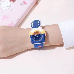 Close-up of children's blue astronaut slap watch with 3D spaceman figure and star pattern