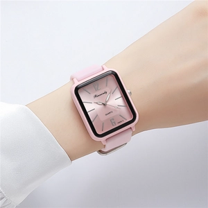 Close-up of pink jelly silicone watch with rectangular dial worn on a female wrist