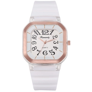 Detail of white silicone strap and rose gold bezel on a square dial quartz watch