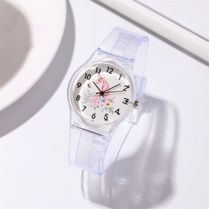 Detailed macro shot of clear blue unicorn watch dial and soft plastic strap