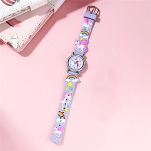 Close-up of kids quartz watch with 3D unicorn and rainbow motifs on purple silicone strap