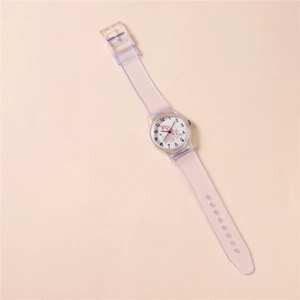 Detail of transparent unicorn kids watch with floral dial and clear plastic strap