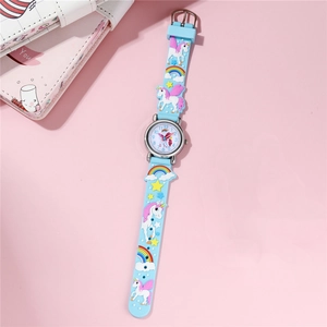 Detailed view of kids quartz watch with 3D unicorn rainbow patterns on silicone strap