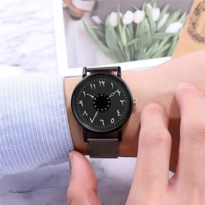 Minimalist black quartz watch with mesh strap and unique Arabic numeral rotating dial