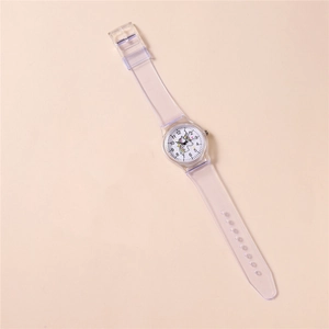 Detail of transparent silicone strap and unicorn dial on children quartz watch