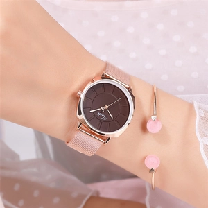 Elegant rose gold mesh strap watch paired with a matching pink accent bracelet on wrist