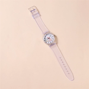 Detail shot of a girl's watch with clear resin strap and cute unicorn dial design
