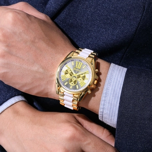 Geneva men's quartz watch with gold metal band and silver roman numeral dial on a suit