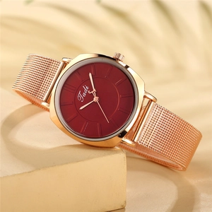Elegant rose gold mesh strap watch with a burgundy dial and minimalist hour markers